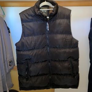Like new. Very warm vest has zipper pockets and an inner pocket.